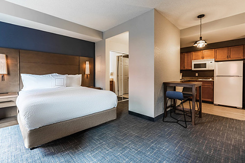 A room at the Residence Inn featuring a King sized bed and kitchenette